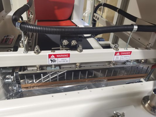 Máquina de embalaje automática de cinta de alta velocidad 450L con envoltura de película