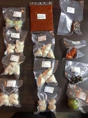 Máquina de embalaje de carne al vacío para bolsas de 1 kg en cámara doble con longitud de barra de sellado de 600 mm