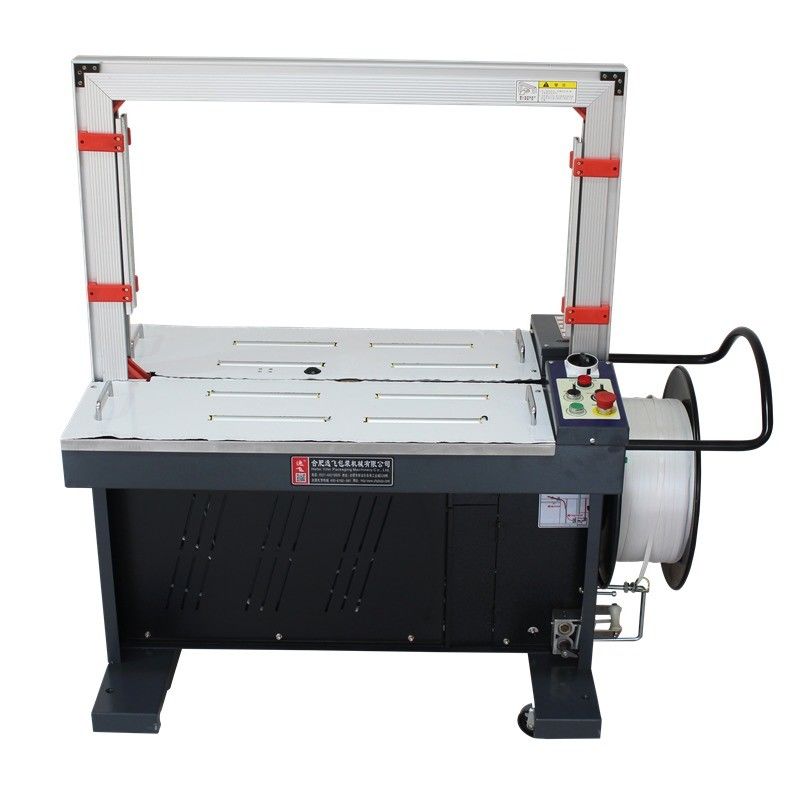 Máquina de envoltura integrada en transportador para cajas y cajas de cartón